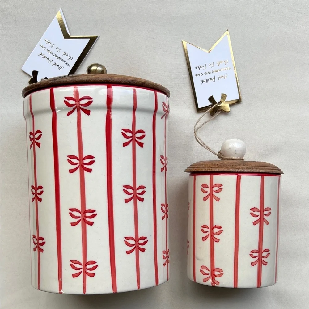 Ceramic holiday canister with red vertical stripes and bows